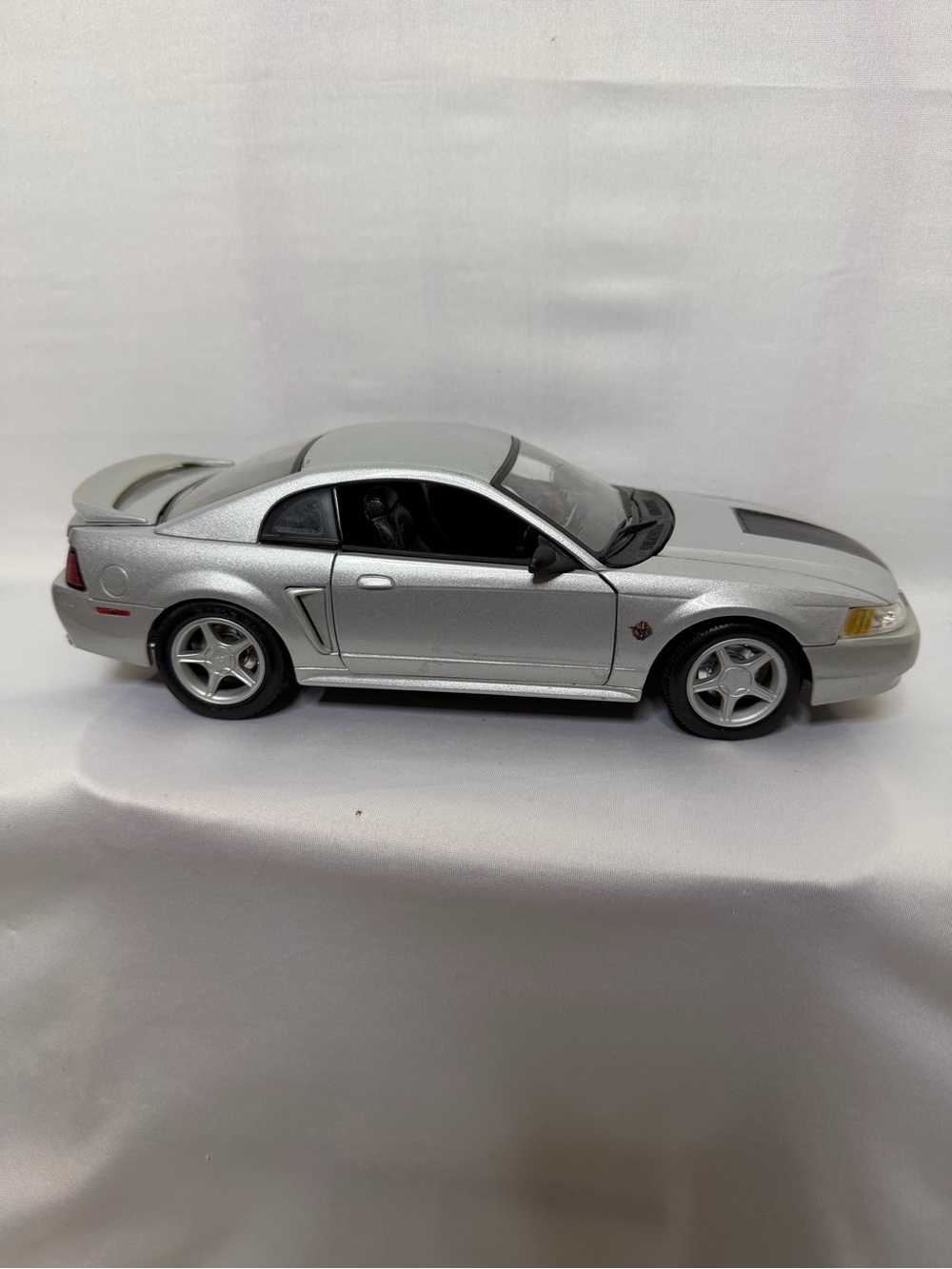 Silver 1999 Ford Mustang GT 1:18 scale diecast model car made by Maisto